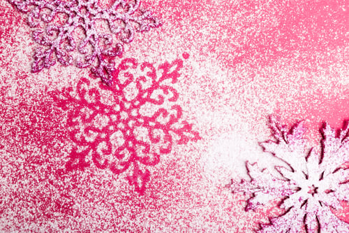 Preview: Pink and white snowflakes on a pink background. Christmas background. Decorative snow.