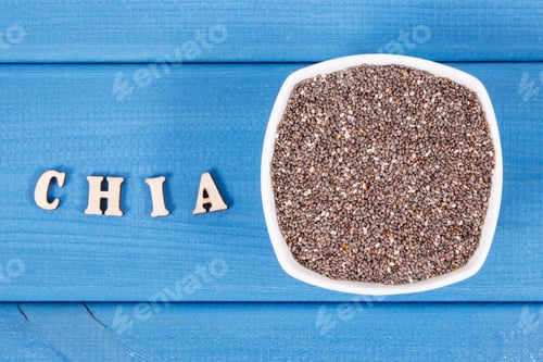 Preview: Inscription chia and seeds in bowl, concept of food containing natural vitamins, fiber and minerals