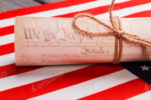 Preview: Close-up old scroll on the us flag.