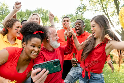 Preview: Supporters watching their team win the game on a mobile phone