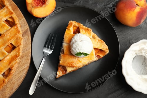 Preview: Slice of delicious peach pie with ice cream on black table, flat lay