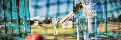 Preview: Low section of sportsman playing cricket at field