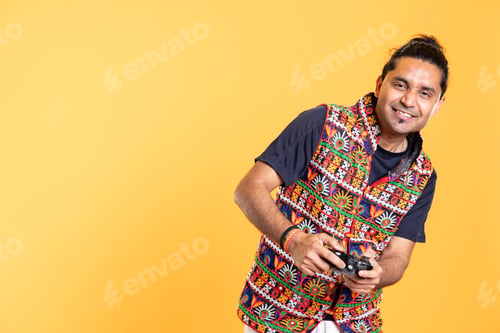 Preview: Delighted man pressing gamepad buttons, having fun defeating enemies