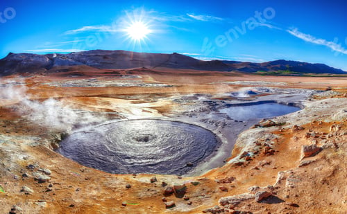 Preview: Boiling mudpots in the geothermal area Hverir and cracked ground around.