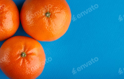 Preview: Ripe Mandarin Close-Up On A White Background. Tangerine Orange. Colorful Food And Drink Still Life