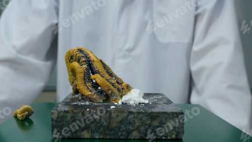 Preview: Chemist or medical research scientist adds fire to a violent chemical reaction. Chemical experience
