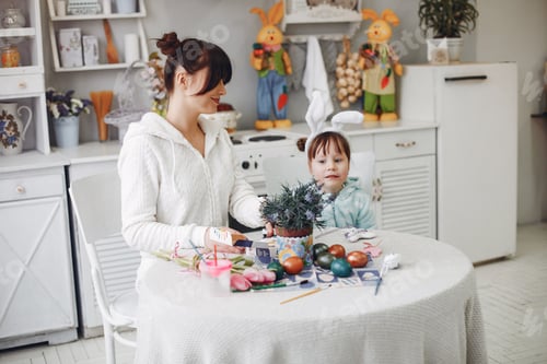 Preview: Mother with little daughter in a kitchen