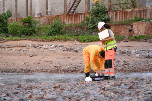Preview: scientists in PPE gear analyzing seawater samples using test tubes and a laptop