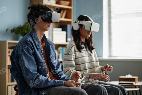 Preview: Teenage Boy and Teenage Girl Experiencing Virtual Reality during Counseling Session