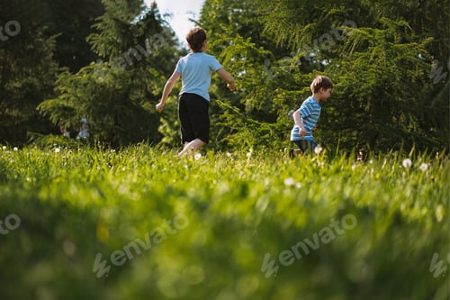 Preview: Children running, having fun, playing tag in park