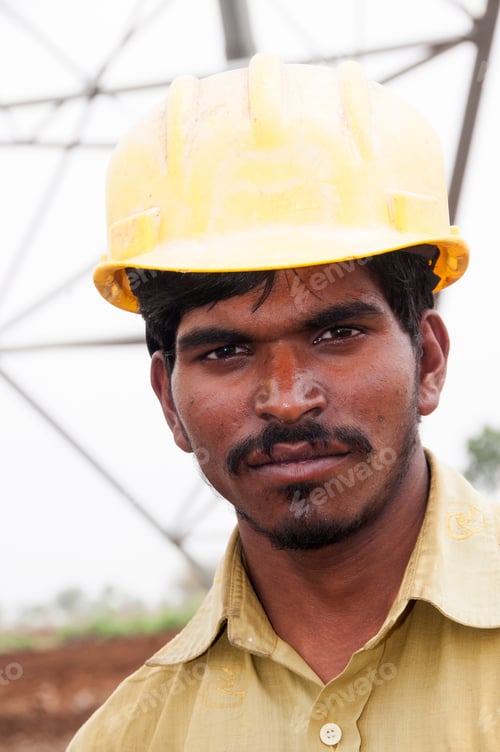 Preview: Portrait of Pylon construction workers, India.