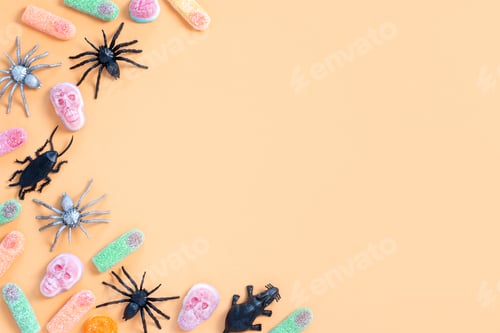 Preview: Halloween sweet background frame with scary pumpkin cookies, candy and Halloween decor