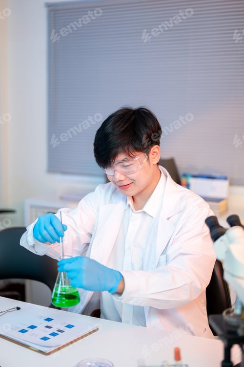 Preview: Scientist researcher man holding glass flask stirring test liquid over document in dim lit lab room.