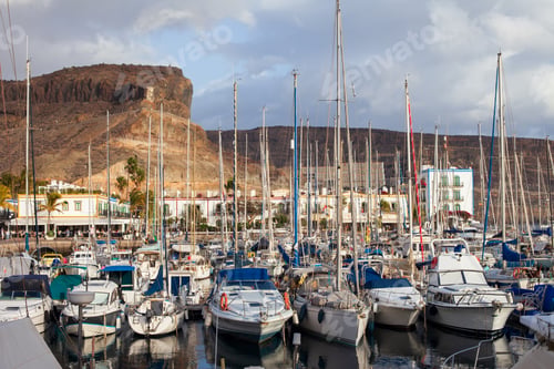 Preview: Sailboats and yachts in harbor on sunset