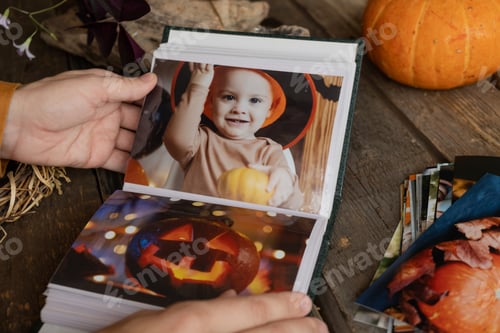 Preview: Browsing Halloween printed photos in picture album.