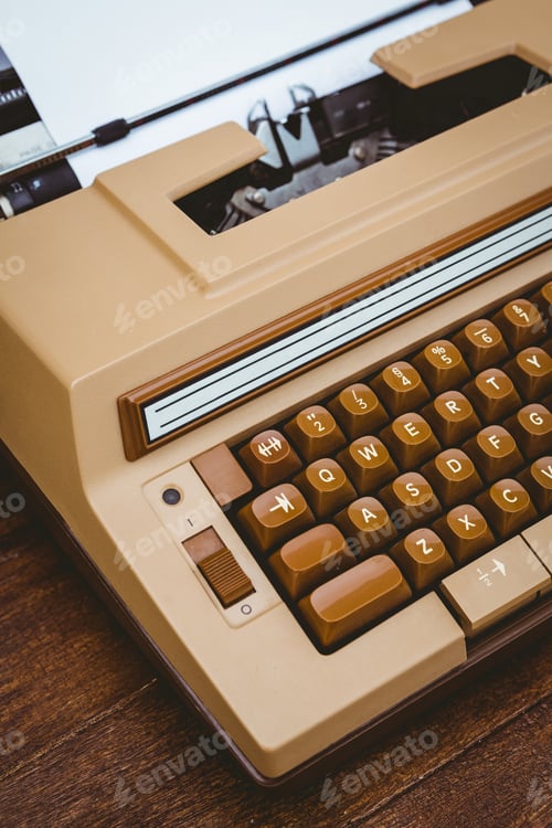 Preview: View of an old typewriter on wood desk