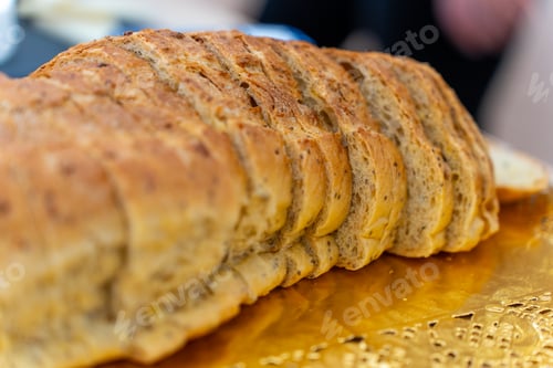 Preview: Sliced multigrain bread loaf displaying fresh crust