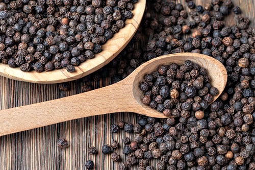 Preview: black pepper on wooden spoon