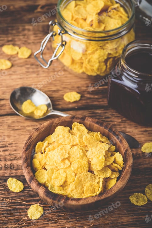 Preview: Breakfast with corn flakes, milk and jam