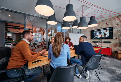 Preview: A diverse team of business professionals engage in discussions on various projects and develop new