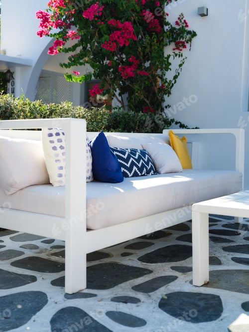 Preview: A cozy place to relax. Cushions on the couch in an outdoor cafe. Traditional Greek design.