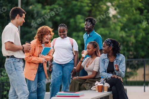 Preview: Group of diverse college students taking a break at university campus.