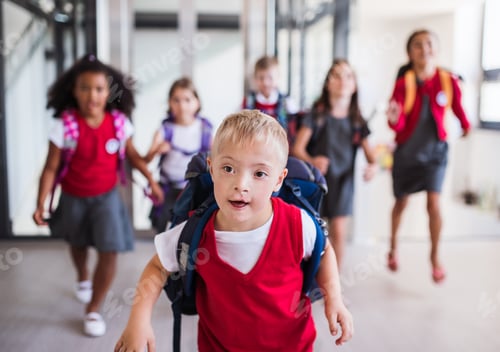 Preview: A down-syndrome school boy with group of children in corridor, running