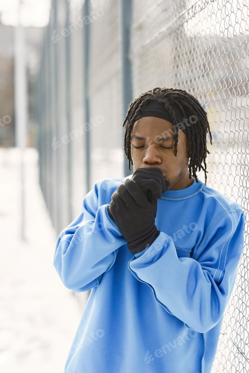 Preview: African american man dstanding on winter day
