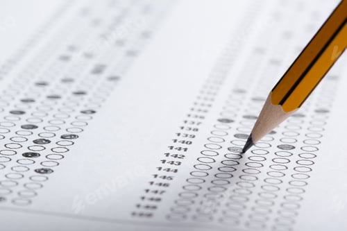 Preview: Students fill out answer sheets with pencils during a test in an examination room