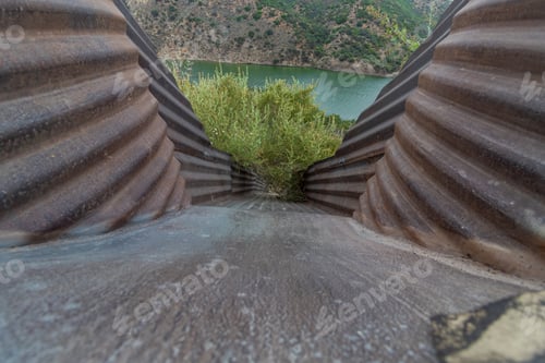 Preview: Selective focus closeup shot of a drainage pipe going into the Pyramid Lake in California