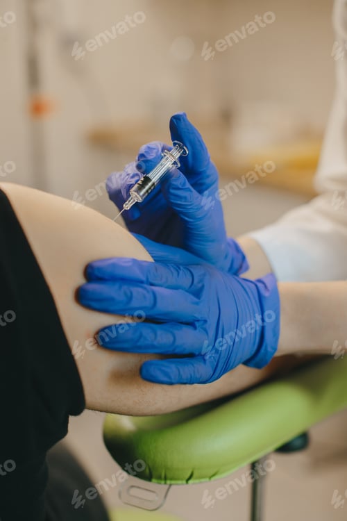 Preview: Healthcare worker giving patient injection for vaccination