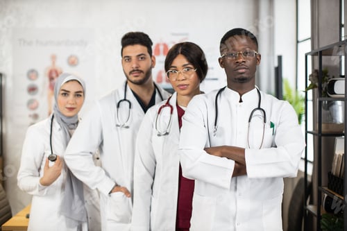 Preview: Confident medical specialists standing together at boardroom