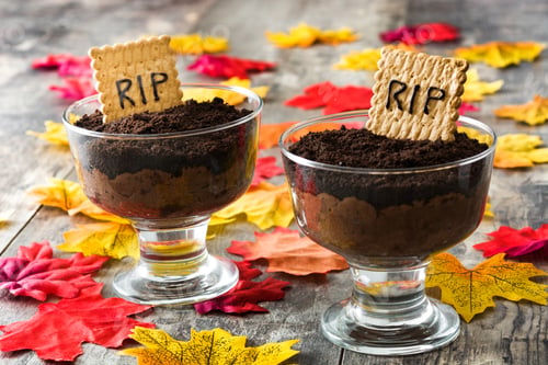 Preview: Halloween dessert representing edible graves with crumbled cookies and rip tombstones