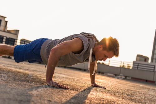 Preview: Young man exercing push ups