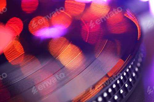 Preview: Vinyl player LP record with blured or defocused lights.
