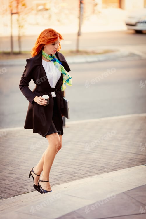 Preview: Succesfull Businesswoman On The Way In Building