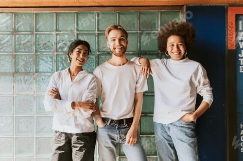 Preview: Three happy diverse friends, by glass box wall
