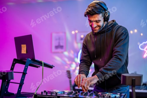 Preview: Caucasian young man artist DJ mixing and scratching music mixer controller.