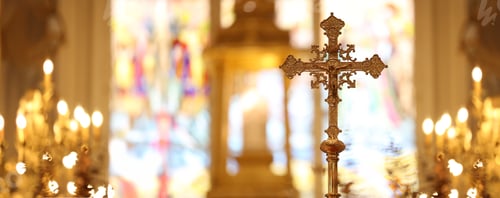 Preview: The cross standing on christian church and flare background.