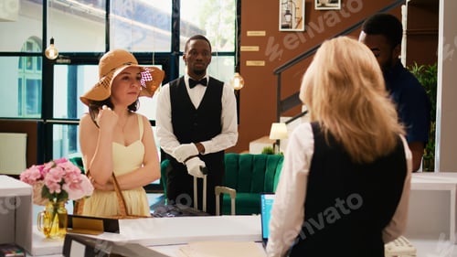 Preview: Hotel staff giving access room card