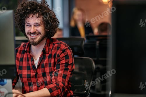 Preview: Focused Programmer With Afro Hairstyle in Plaid Shirt Working on Computer in Office Environment