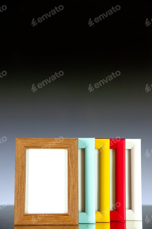 Preview: front view different picture frames with colored corners on light dark background picture family