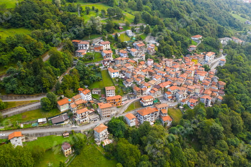 Preview: Arial view on mountain Italian village, Garzeno. High angle view of houses with red roofs amoung