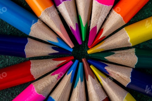 Preview: top view of colored pencils on dark background