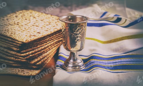 Preview: Passover wine and matzoh jewish holiday bread over wooden board.