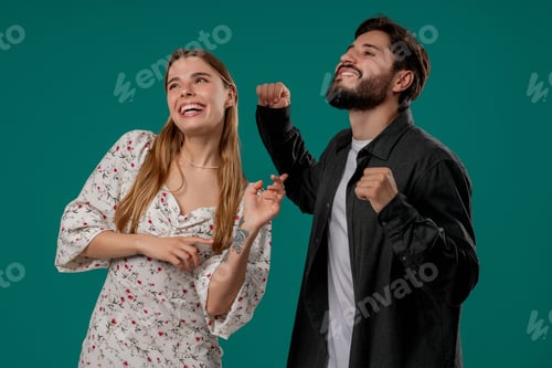 Preview: Positive Happy Young Couple Dancing. Green Studio Wall. Music, Dance, Party,love