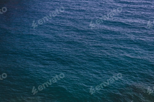 Preview: ocean or sea water textured dark blue background. surface and texture calm shallow waves spa marine