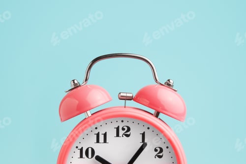 Preview: Red alarm clock on blue background