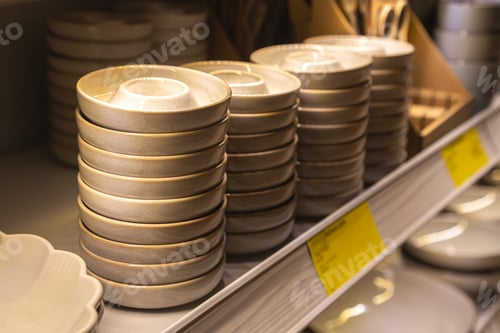 Preview: Shelf with ceramic plates for sell in a tableware store.