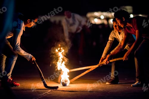 Preview: Friends playing with fire at night.